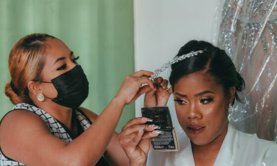 Woman having her hair and makeup prepared in a beauty studio